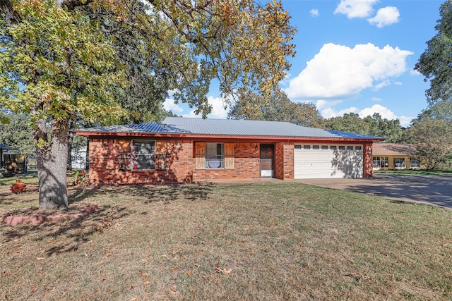 ranch-style home featuring a garage and a front lawn