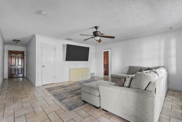 living room with a textured ceiling and ceiling fan