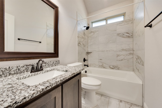 full bathroom with vanity, toilet, and tiled shower / bath