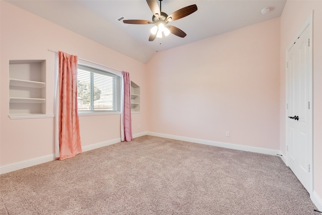 empty room featuring carpet flooring, ceiling fan, and lofted ceiling