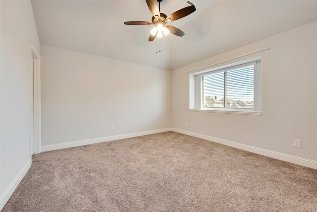 empty room with ceiling fan and carpet floors