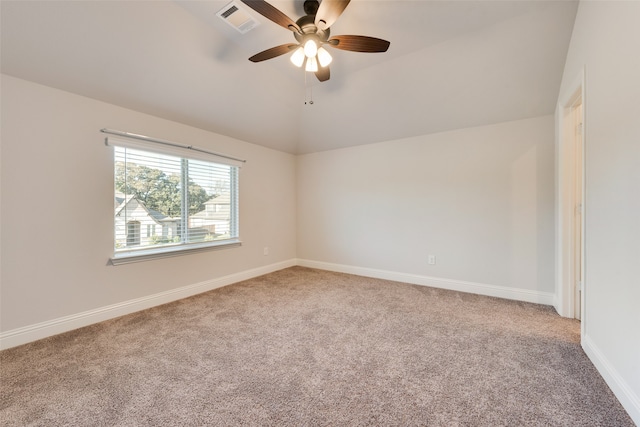 empty room featuring carpet, ceiling fan, and lofted ceiling