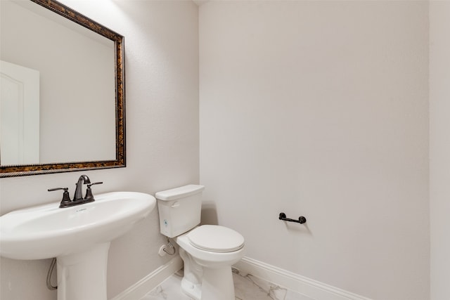 bathroom with toilet and sink