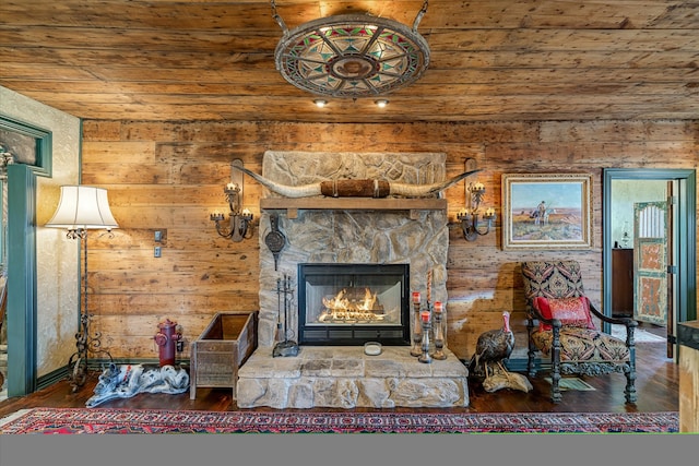 living room with wood ceiling, a fireplace, and wood-type flooring