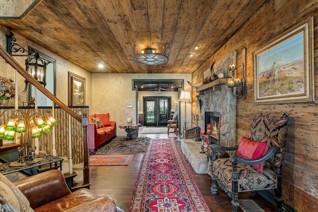 living room featuring french doors, dark hardwood / wood-style flooring, and wood ceiling