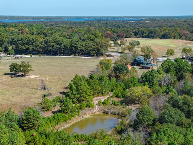 birds eye view of property featuring a rural view and a water view