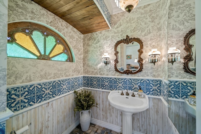 bathroom with ornamental molding and wood ceiling