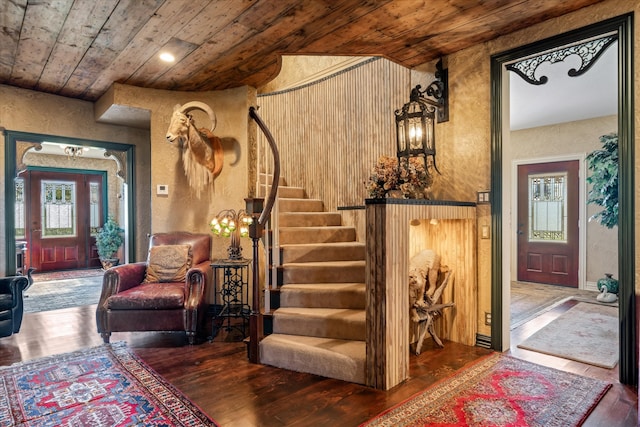 entryway featuring hardwood / wood-style flooring, plenty of natural light, and wooden ceiling