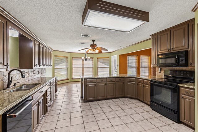 kitchen featuring light tile patterned floors, ornamental molding, a sink, black appliances, and backsplash