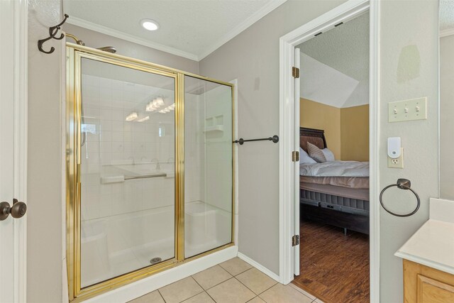 full bath with tile patterned floors, ornamental molding, a stall shower, vanity, and a bath