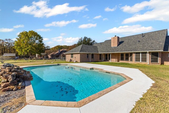 outdoor pool with a lawn