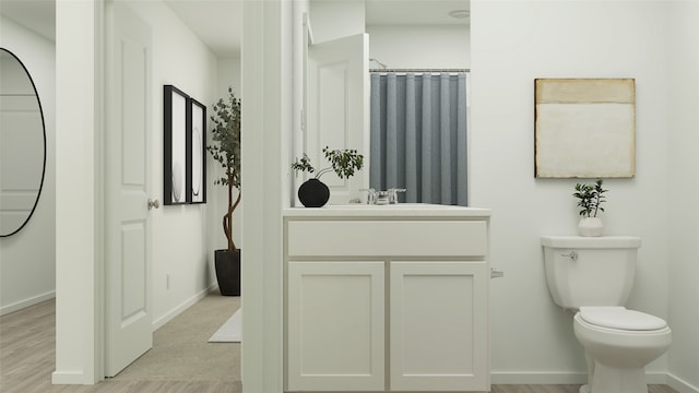 bathroom featuring hardwood / wood-style flooring, vanity, curtained shower, and toilet