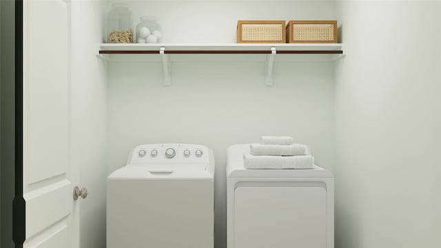 laundry room featuring washing machine and clothes dryer