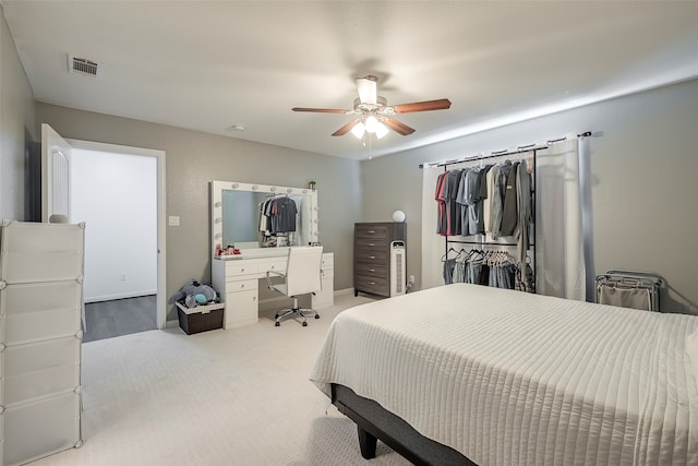 bedroom featuring ceiling fan and light colored carpet