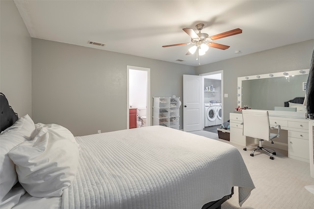 carpeted bedroom with washer and clothes dryer and ceiling fan