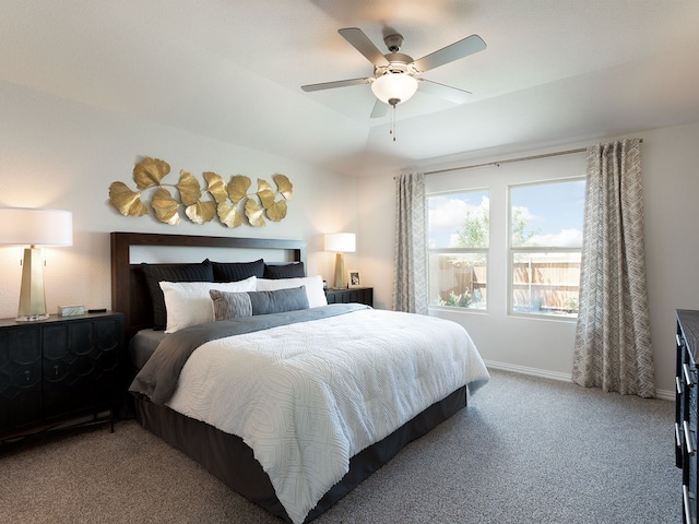 bedroom featuring ceiling fan and carpet