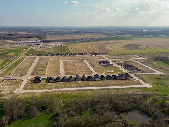 birds eye view of property with a rural view