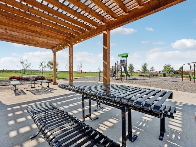 view of patio / terrace with a pergola and a playground