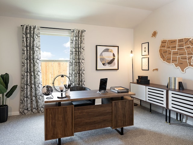 home office with lofted ceiling and carpet floors