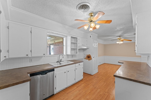 kitchen featuring white cabinetry, dishwasher, light wood-type flooring, and sink