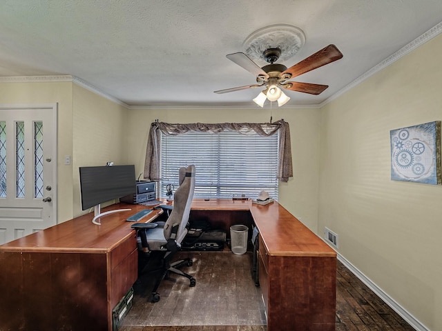 home office with crown molding, dark hardwood / wood-style flooring, ceiling fan, and a textured ceiling