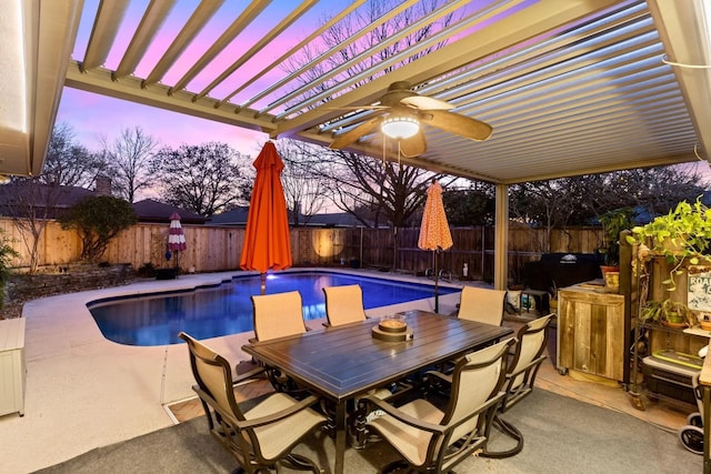 pool at dusk with a pergola, a patio area, and ceiling fan