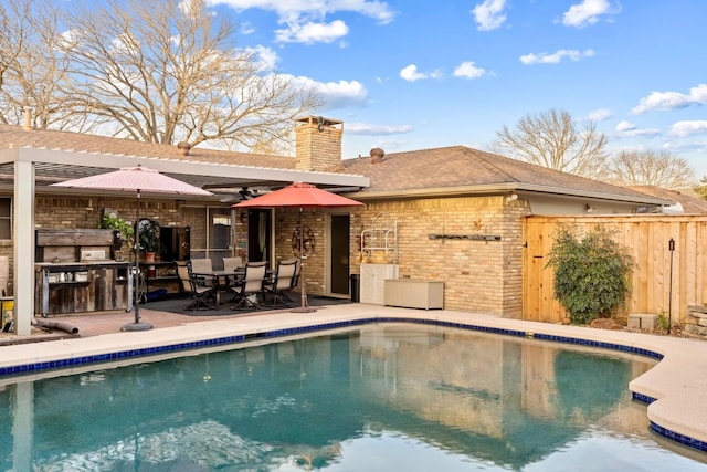 exterior space with ceiling fan and a patio