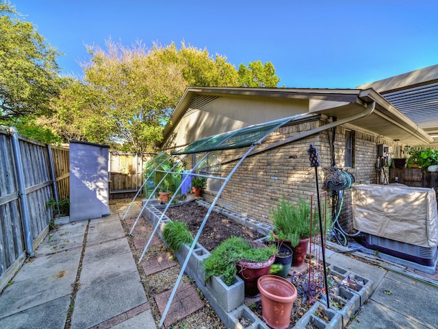 view of side of property with a patio area