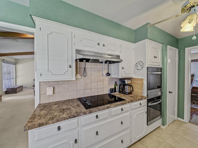 kitchen with backsplash, ceiling fan, black electric stovetop, and white cabinets