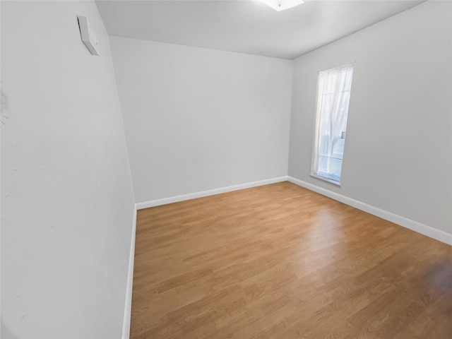 unfurnished room with light hardwood / wood-style floors