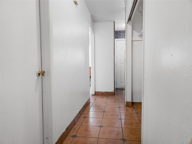 hall featuring tile patterned flooring