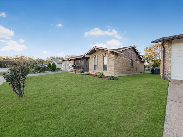 view of side of home featuring a yard