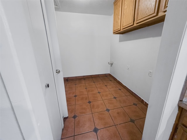 laundry room with light tile patterned floors