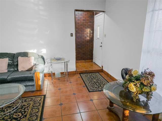 tiled living room with a healthy amount of sunlight