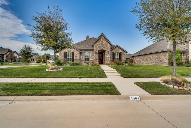 view of front of home with a front yard