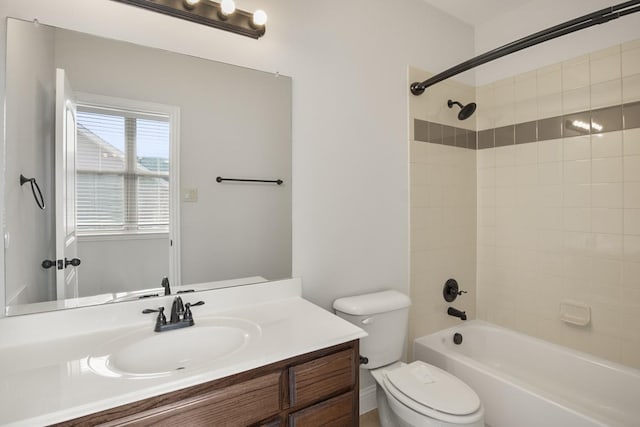 full bathroom featuring vanity, toilet, and tiled shower / bath