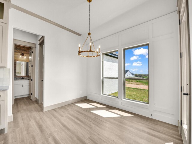 bathroom featuring hardwood / wood-style flooring, vanity, and a shower with door