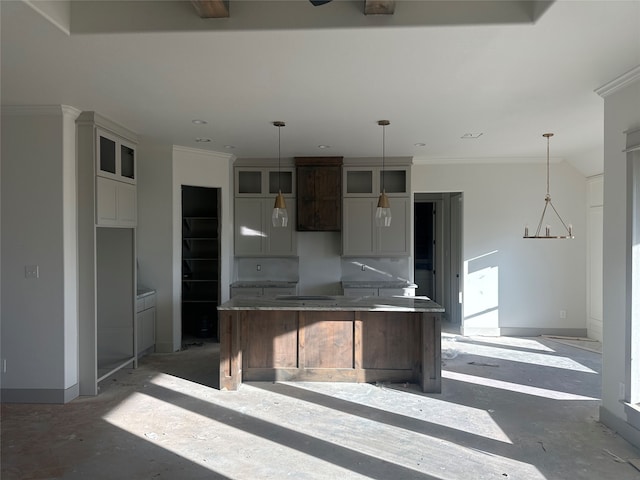 kitchen featuring crown molding and hanging light fixtures