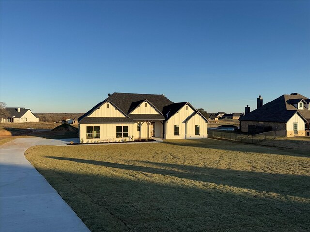 modern inspired farmhouse with a front yard