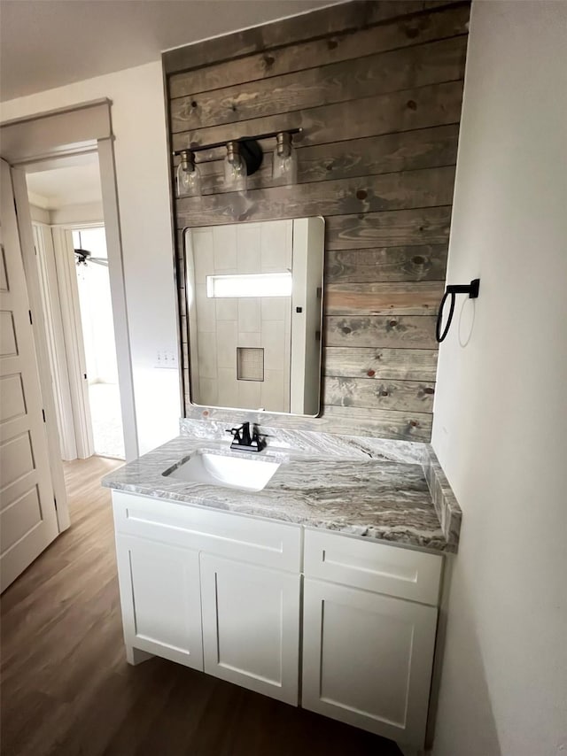 bathroom featuring hardwood / wood-style flooring and vanity