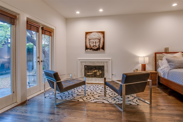 interior space with a fireplace, dark hardwood / wood-style flooring, and access to exterior