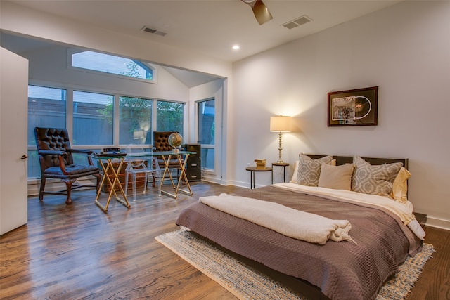 bedroom featuring ceiling fan, dark wood-type flooring, and vaulted ceiling