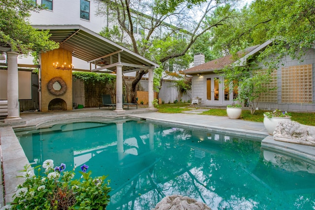 view of pool featuring a patio area and an outdoor structure