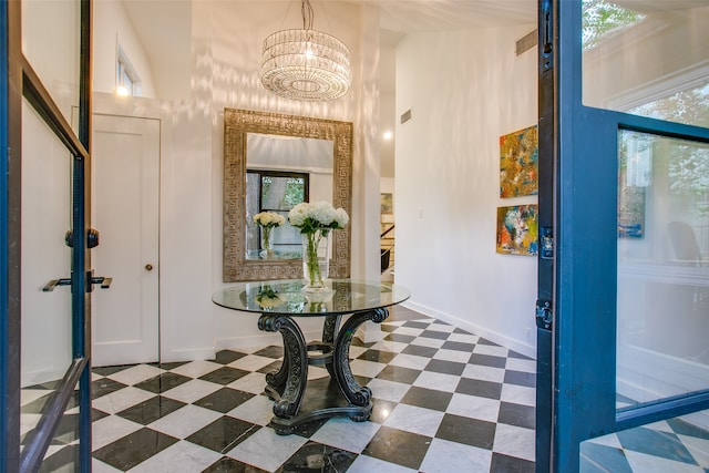 entryway with a notable chandelier