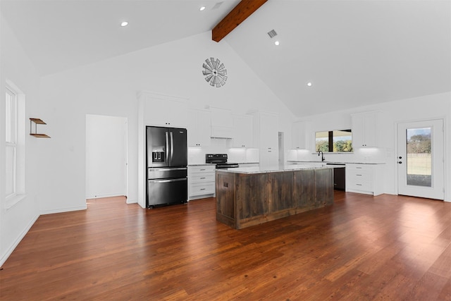 kitchen featuring stainless steel appliances, dark wood-type flooring, high vaulted ceiling, beamed ceiling, and a center island