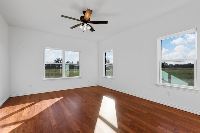 empty room with ceiling fan and wood-type flooring