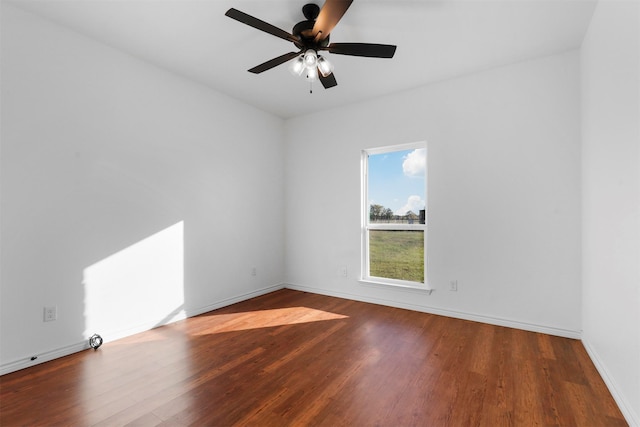 empty room with ceiling fan and wood-type flooring