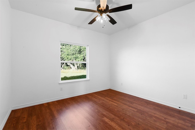 unfurnished room featuring dark hardwood / wood-style flooring and ceiling fan