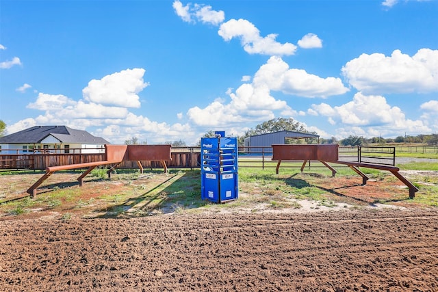 view of jungle gym featuring a rural view