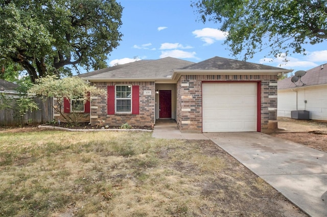 ranch-style house with a garage and a front lawn